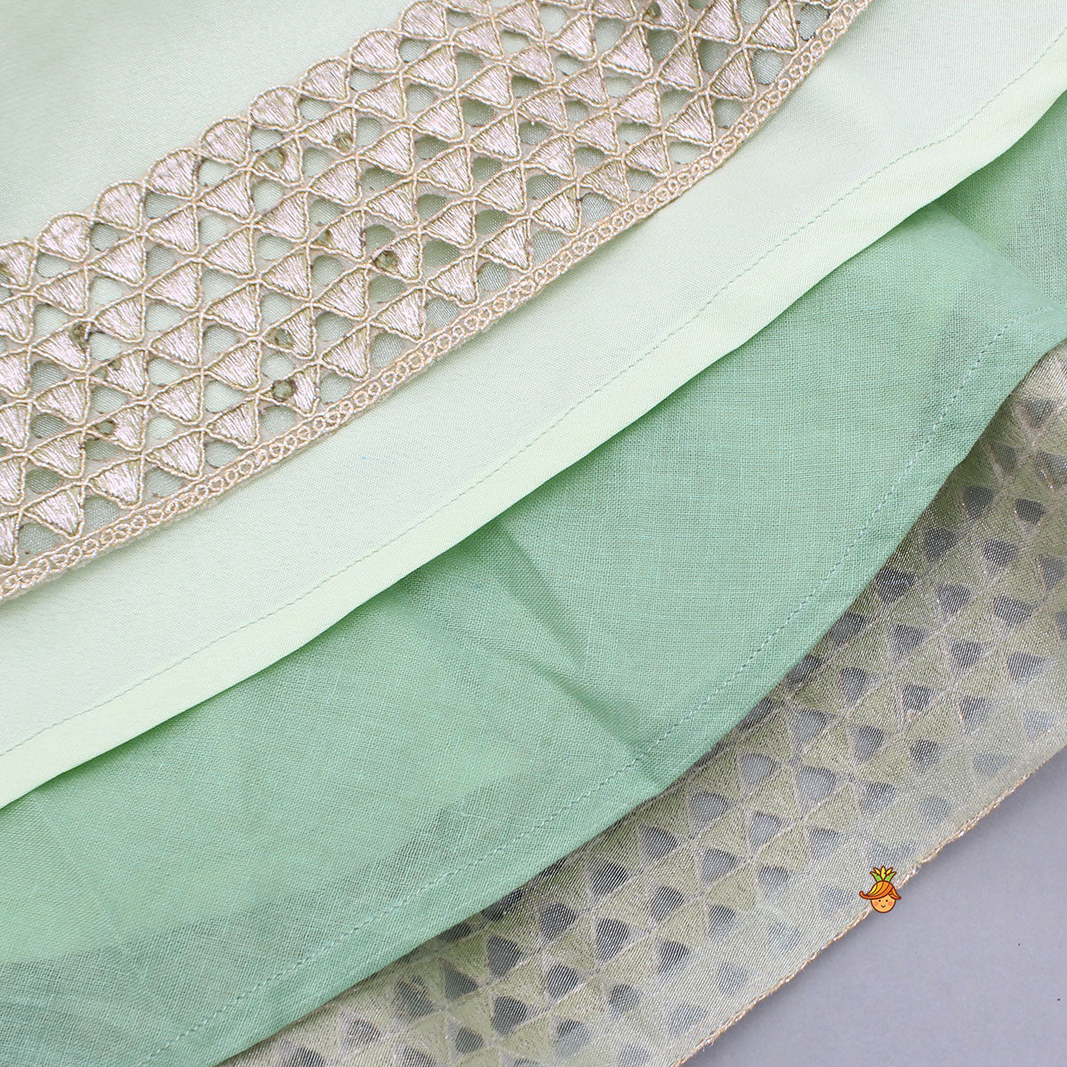 Floral Embroidered Green Sleeveless Top And Fabric Flower Tassels Adorned Lehenga With Ruffle Dupatta