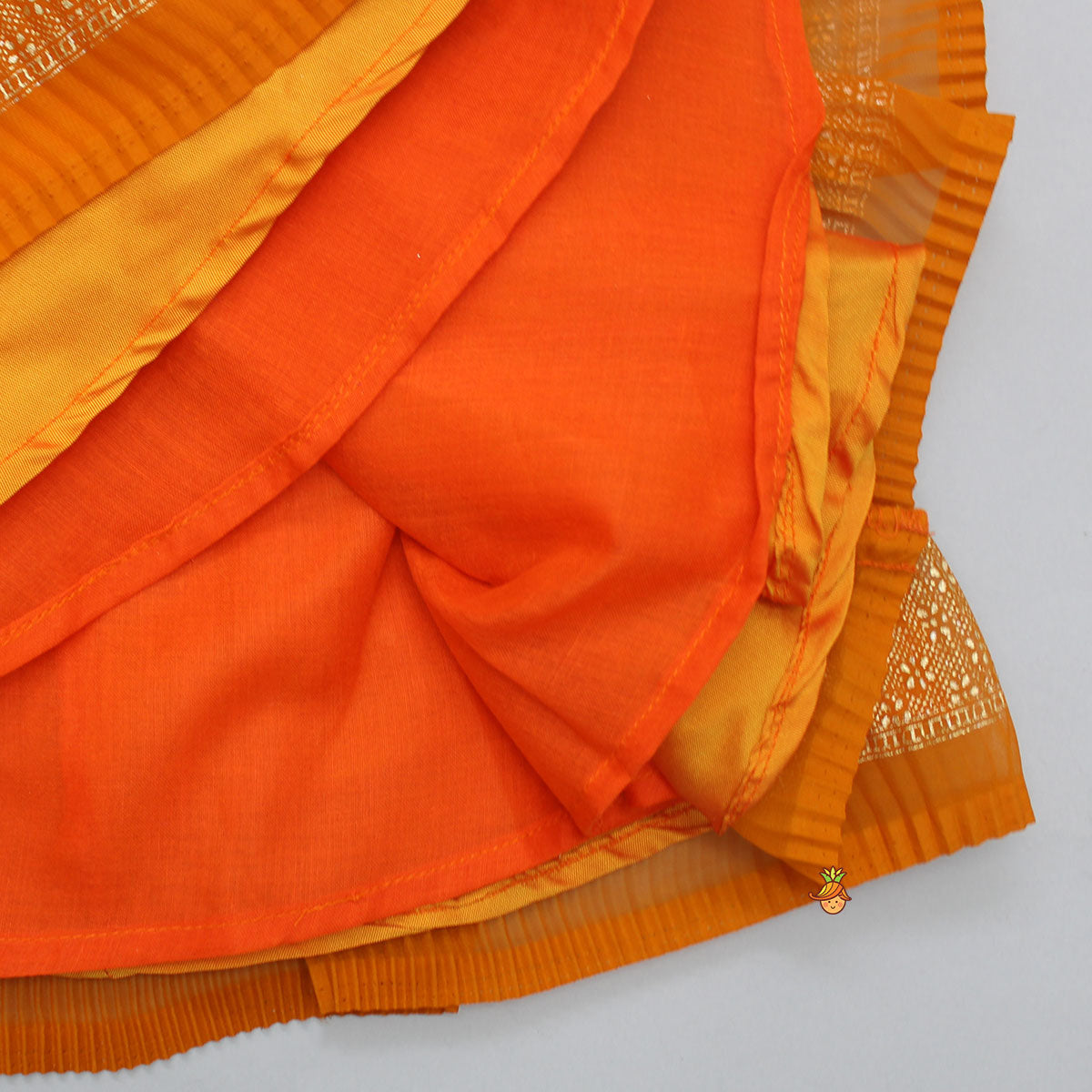Rust Orange Pleated Georgette Top And Lehenga With Hair Clip
