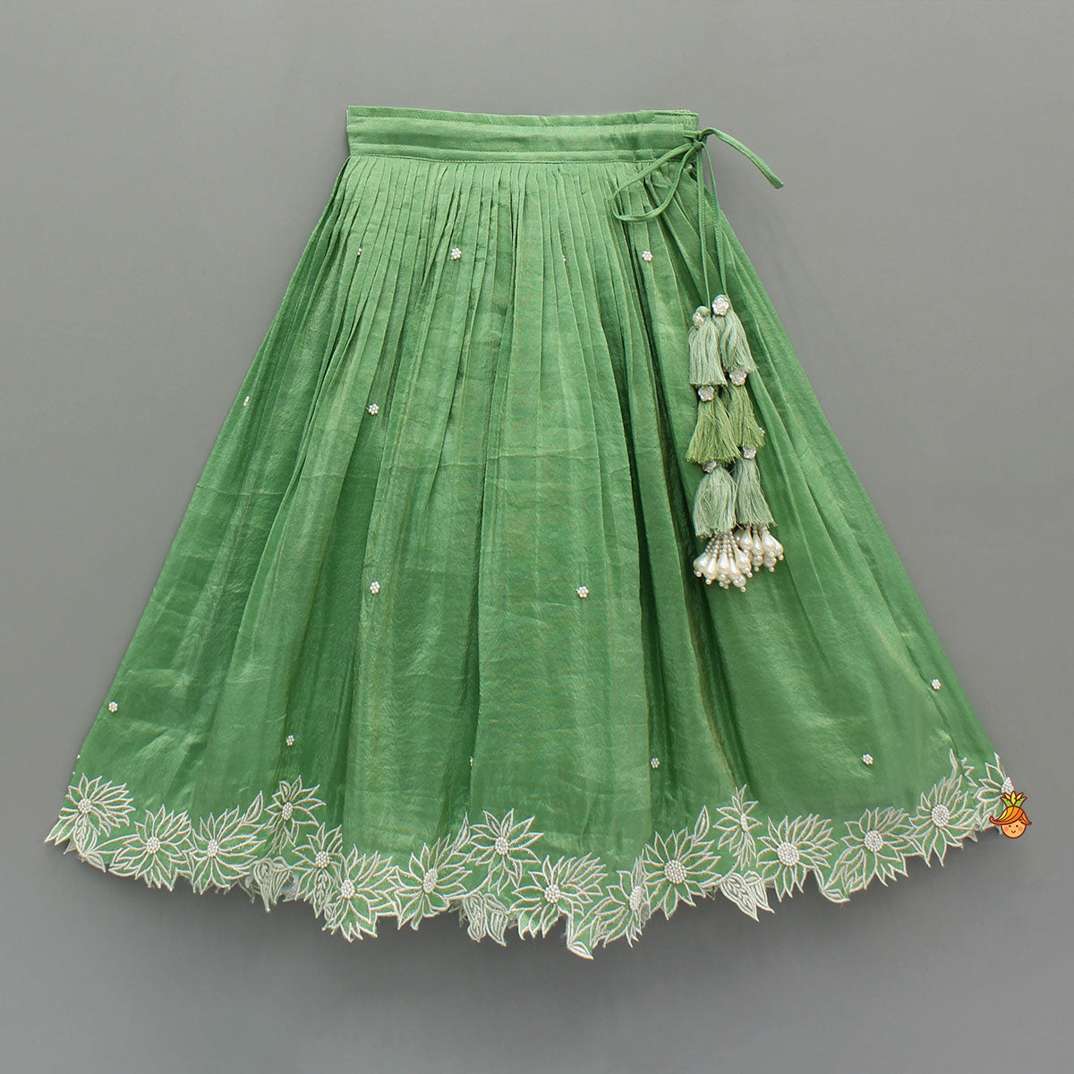 Pleated Neckline Green Shimmery Top And Fringes Tassels Enhanced Lehenga
