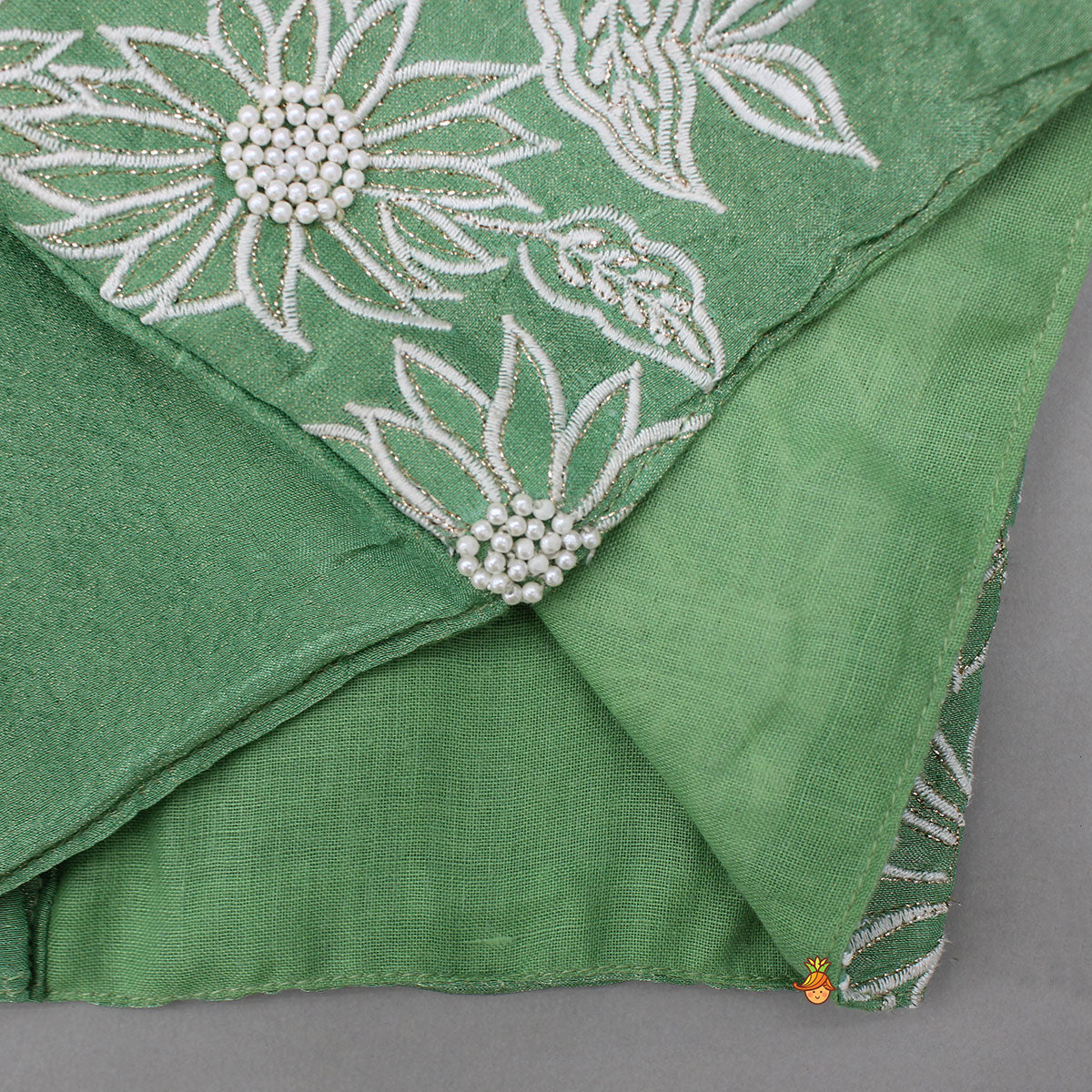 Pleated Neckline Green Shimmery Top And Fringes Tassels Enhanced Lehenga
