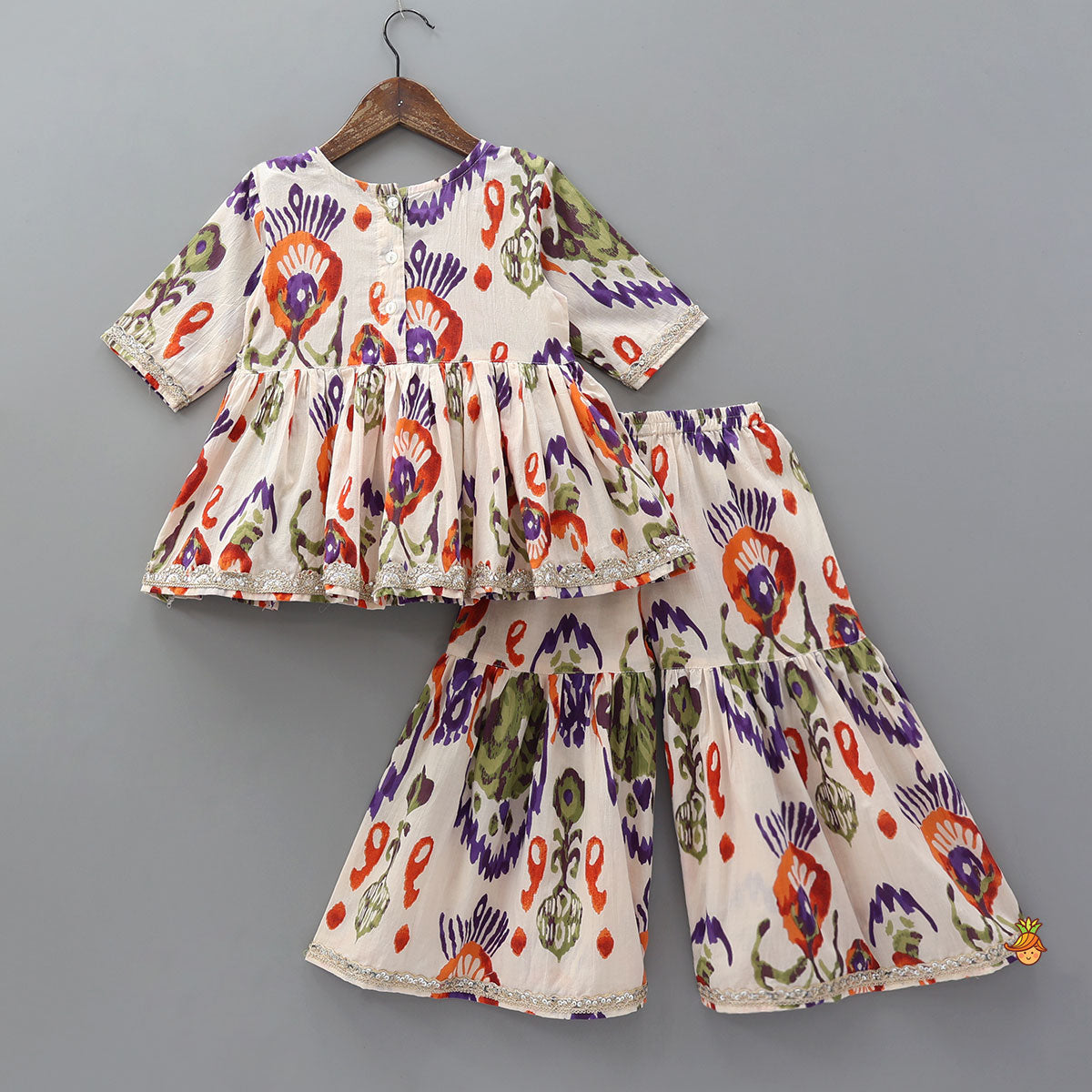 Tassels Enhanced Multicolour Printed Kurti And Sharara With Scalloped Lace Detail Dupatta