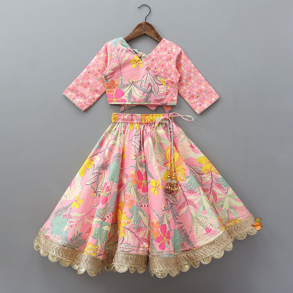 Buttons Adorned Pink Top And Scalloped Lace Work Floral Lehenga