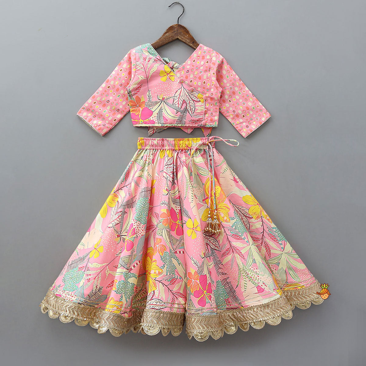 Buttons Adorned Pink Top And Scalloped Lace Work Floral Lehenga