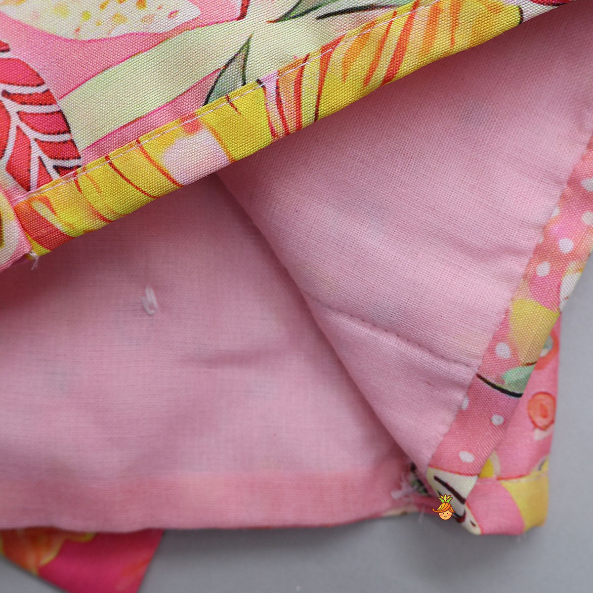Buttons Adorned Pink Top And Scalloped Lace Work Floral Lehenga
