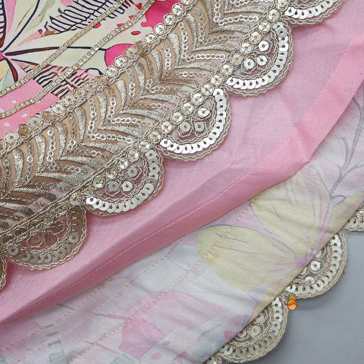 Buttons Adorned Pink Top And Scalloped Lace Work Floral Lehenga