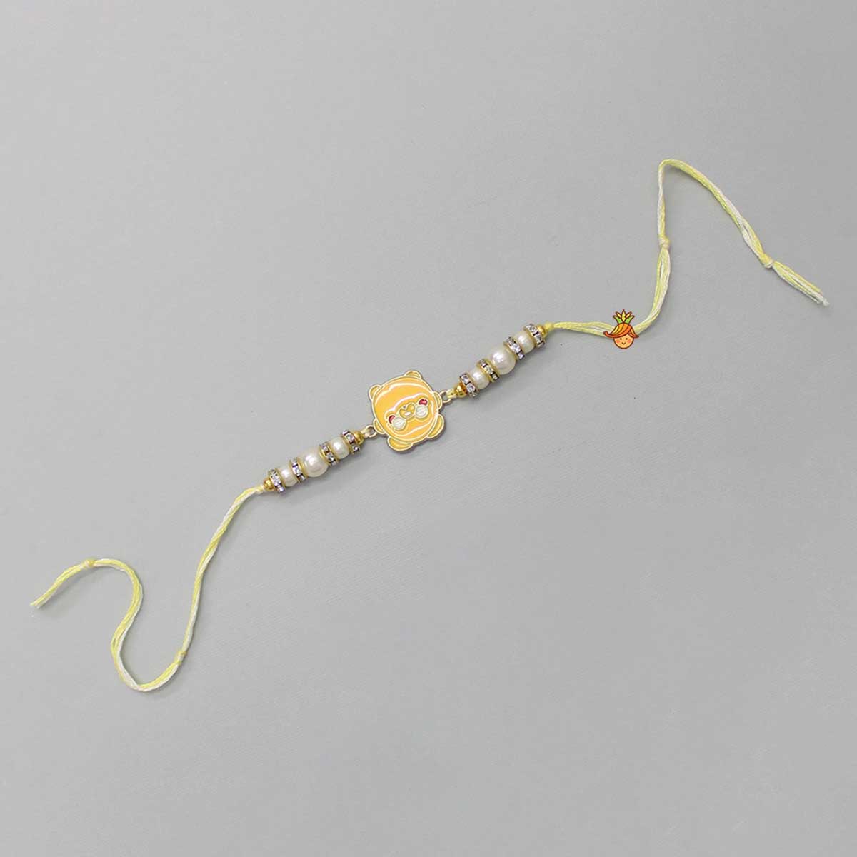 Cute Yellow Metal Rakhi