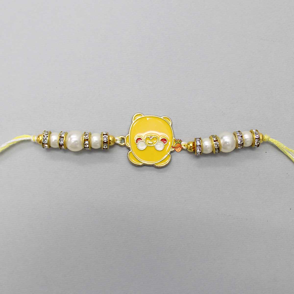 Cute Yellow Metal Rakhi