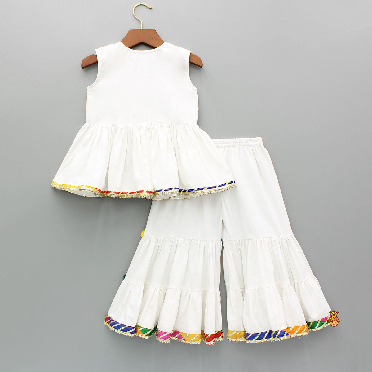 Front Slit White Top And Contrasting Pom Poms Adorned Sharara