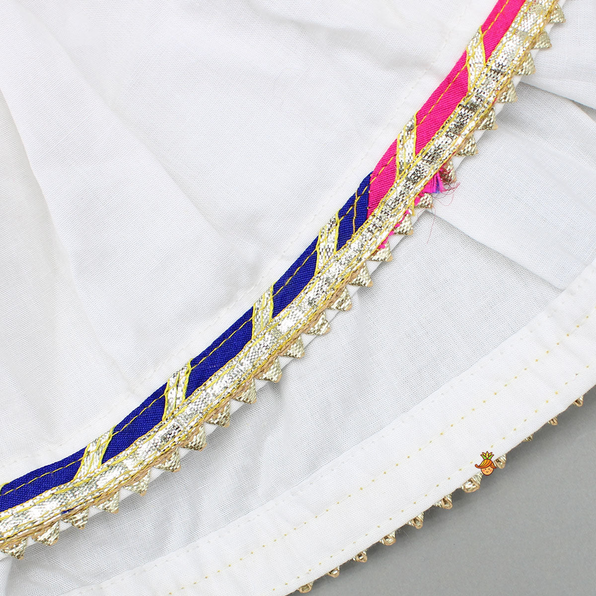 Front Slit White Top And Contrasting Pom Poms Adorned Sharara