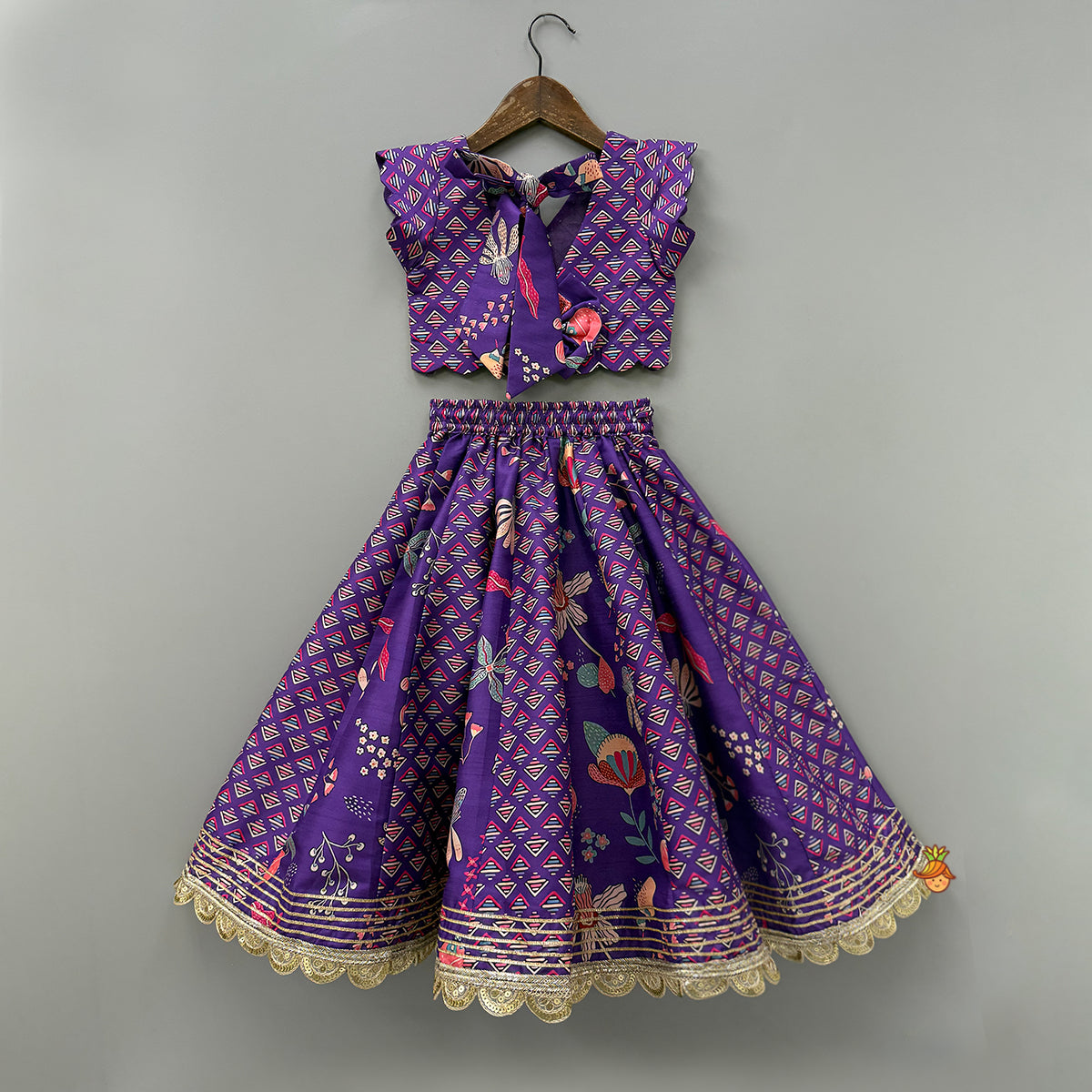 Scalloped Hem V Neck Purple Top And Lehenga With Matching Hair Band