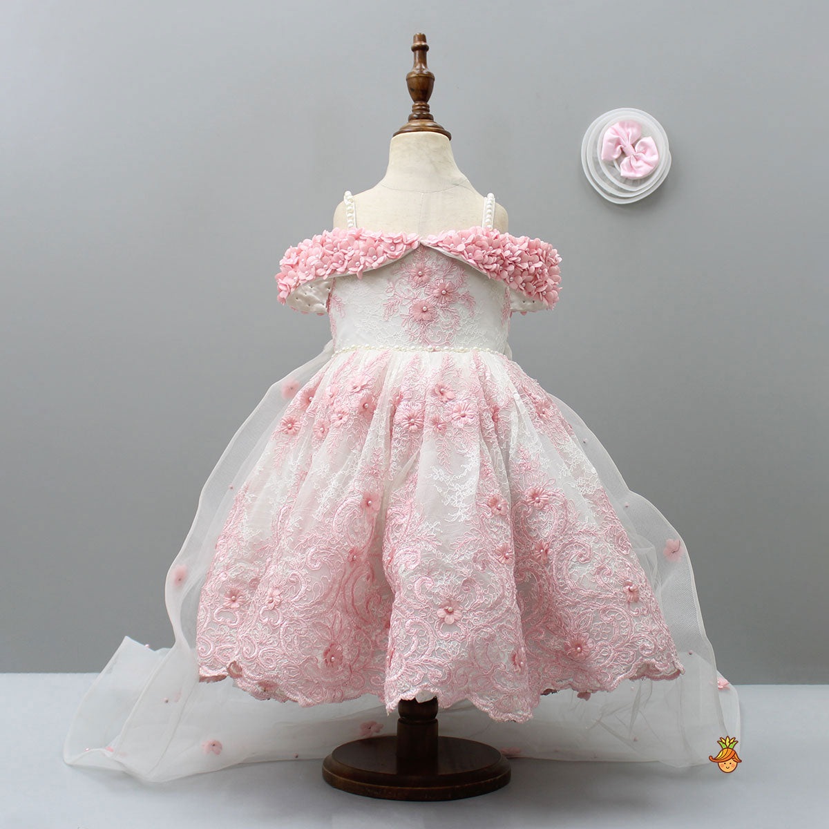 Off Shoulder Fabric Flowers Adorned Wings Gown With Detachable Trail And Matching Hair Clip