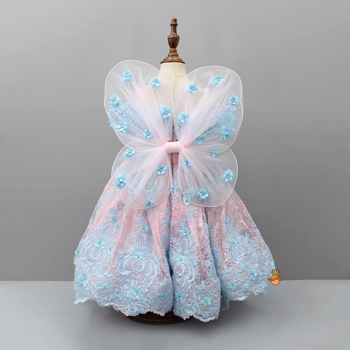Off Shoulder Fabric Flowers Adorned Dual Tone Wings Gown With Detachable Trail And Matching Hair Clip