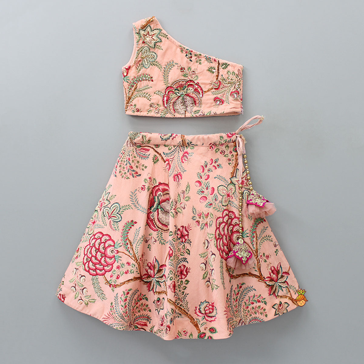 One Shoulder Embroidered Peach Velvet Top And Printed Lehenga