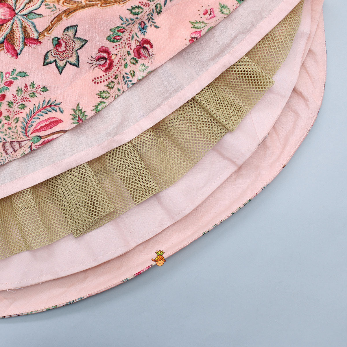 One Shoulder Embroidered Peach Velvet Top And Printed Lehenga