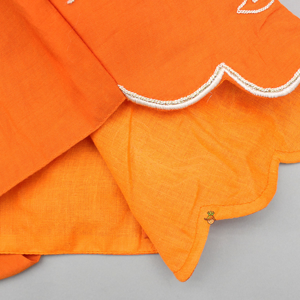 Orange Embroidered Dual Back Knot Detailed Top And Lehenga With Scalloped Hem Detailing