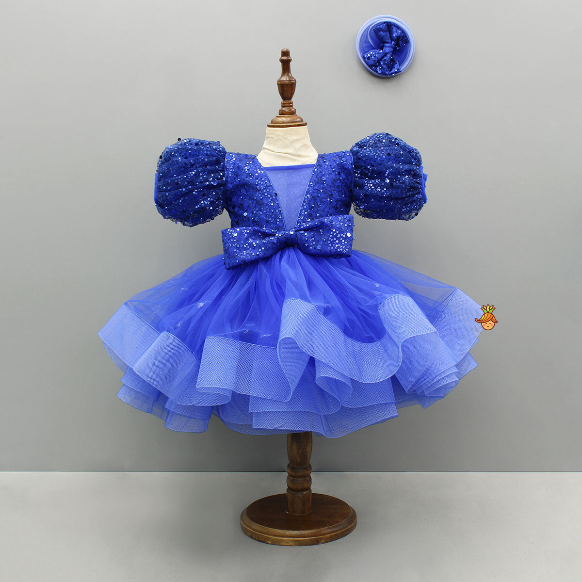 Sequined Ruffled Blue Dress With Bows And Matching Swirled Bow Hairclip