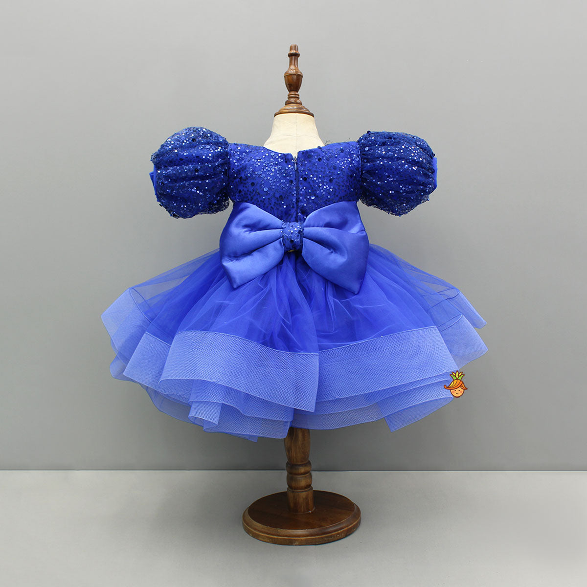Sequined Ruffled Blue Dress With Bows And Matching Swirled Bow Hairclip