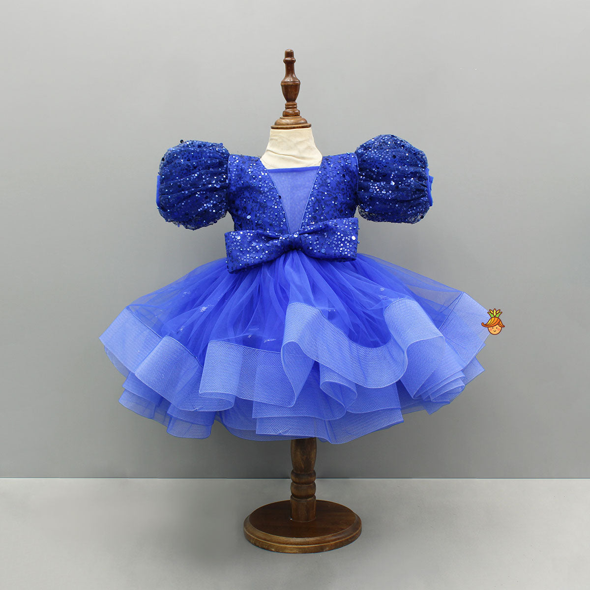 Sequined Ruffled Blue Dress With Bows And Matching Swirled Bow Hairclip