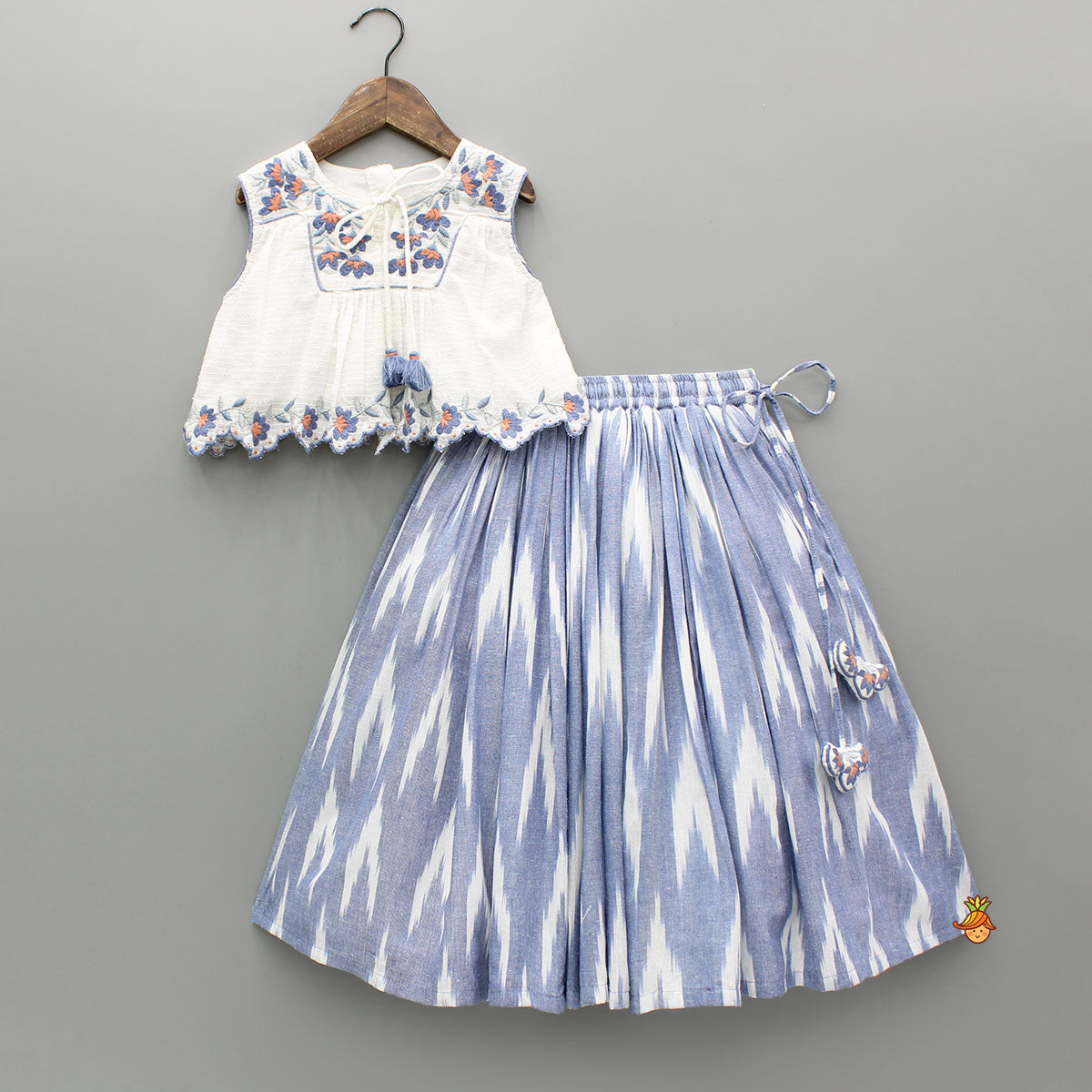 Cotton Top With Knot-Detailed Neckline And Ikat Printed Lehenga