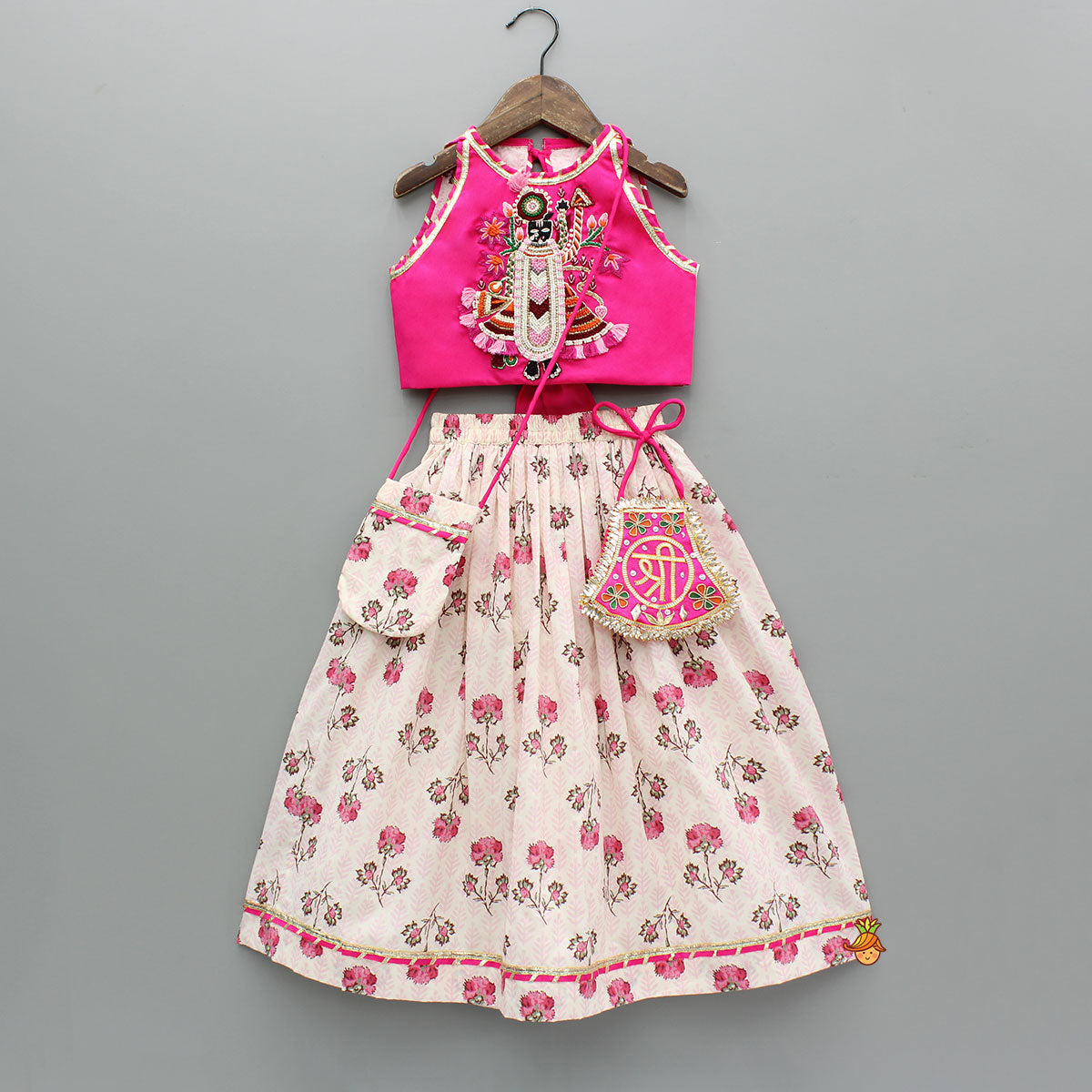 Goddess Embroidered Pink Top And Beautiful Tassels Embellished Lehenga With Matching Sling Bag