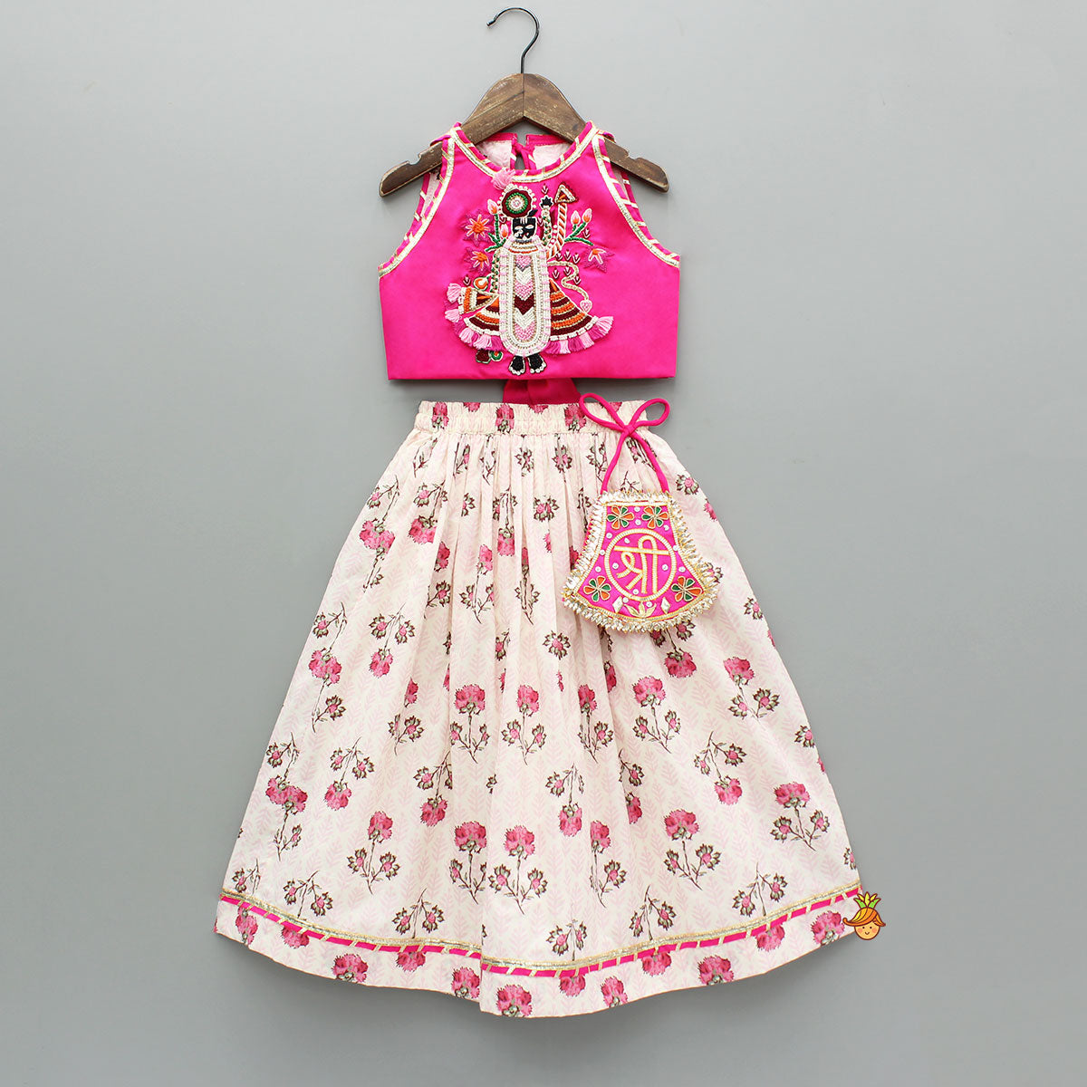 Goddess Embroidered Pink Top And Beautiful Tassels Embellished Lehenga With Matching Sling Bag
