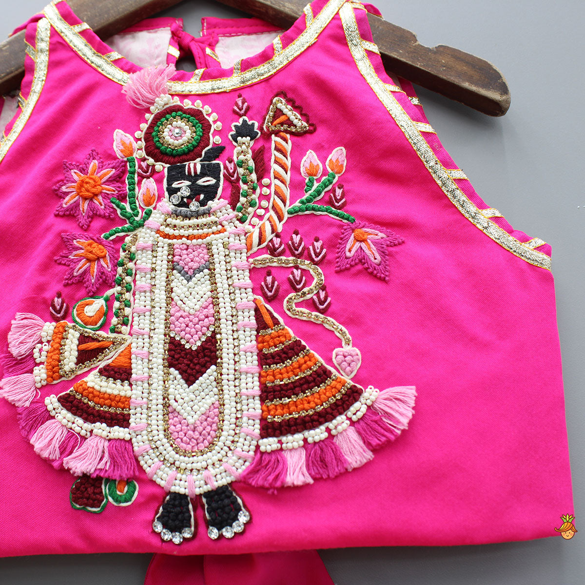 Goddess Embroidered Pink Top And Beautiful Tassels Embellished Lehenga With Matching Sling Bag