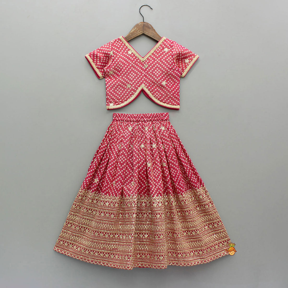 V-Neck Bandhani-Printed Pink Shimmery Top And Lehenga With Sequins Embroidered Matching Dupatta