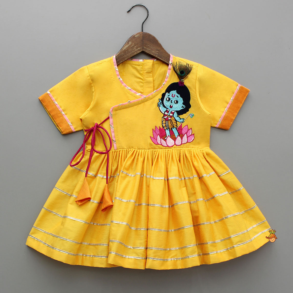 Krishna Embroidered Yellow Angarkha Top With Lace Work Pink Dhoti And Mukut