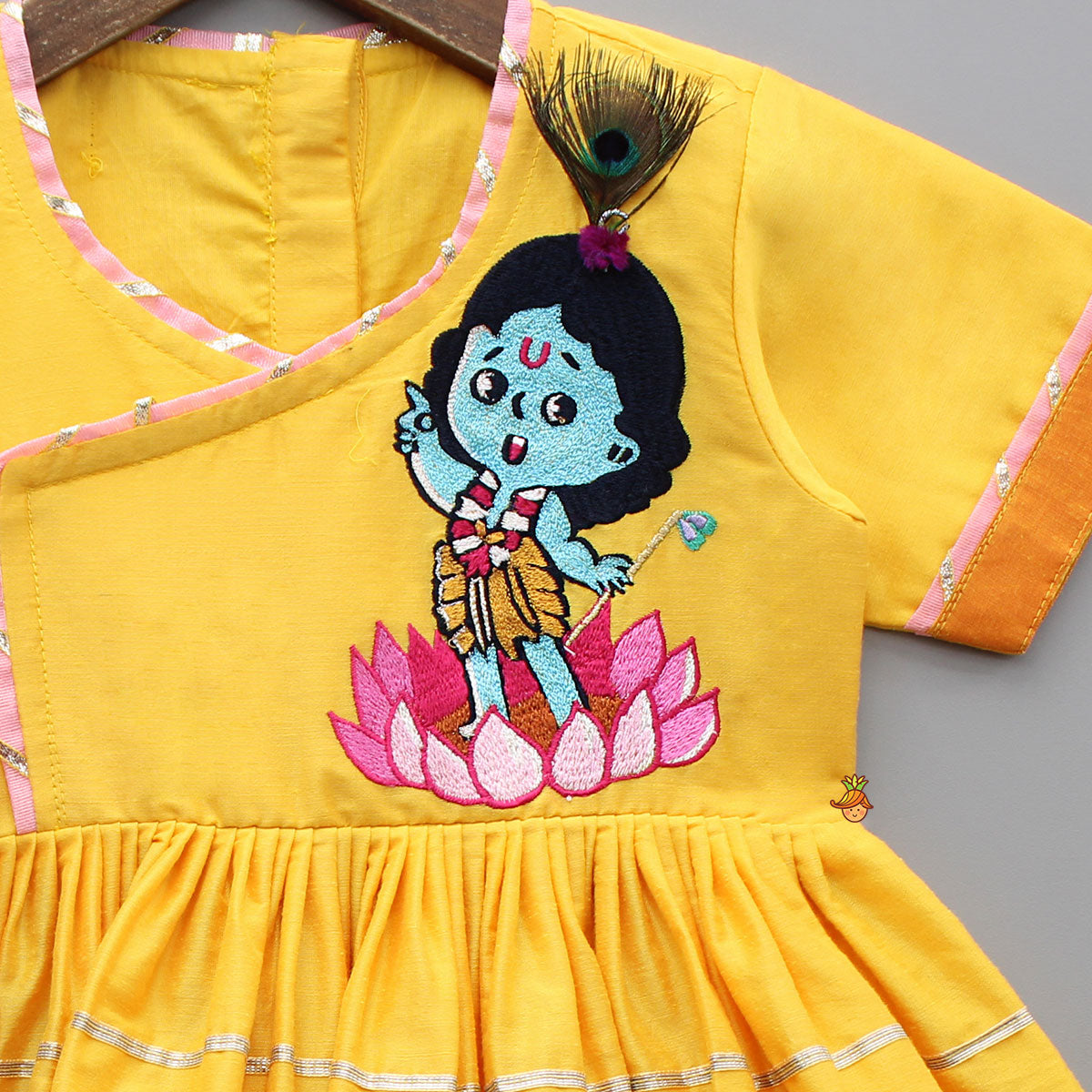 Krishna Embroidered Yellow Angarkha Top With Lace Work Pink Dhoti And Mukut