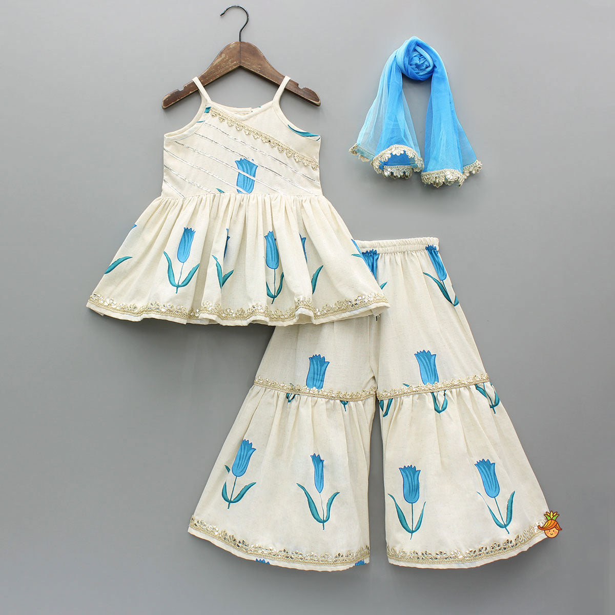 Tulip Printed Strappy Off White Kurti With Printed Sharara And Blue Dupatta