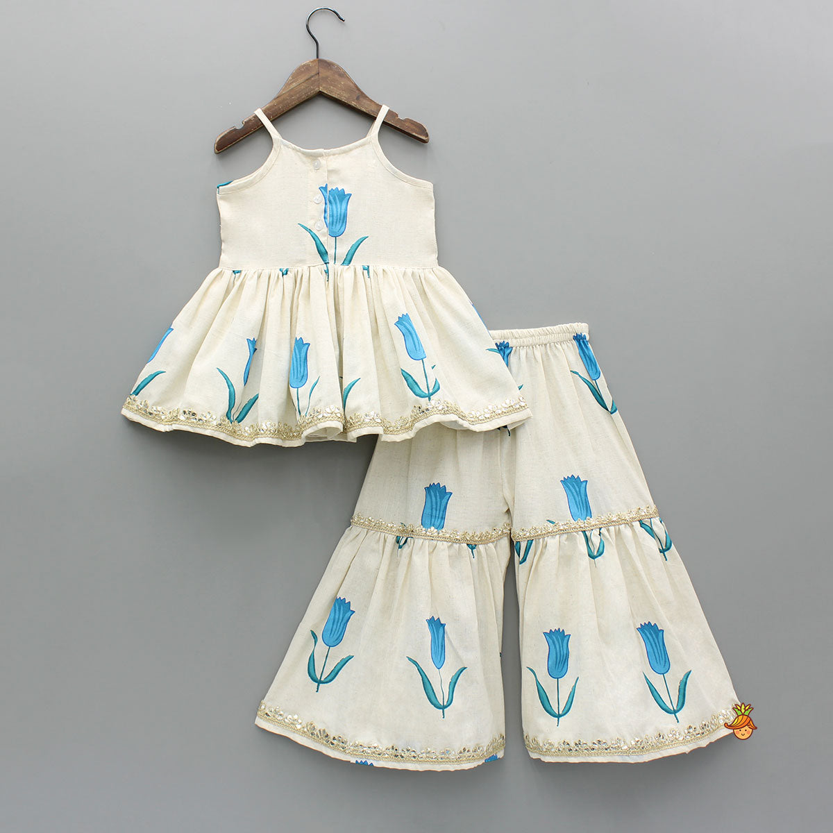 Tulip Printed Strappy Off White Kurti With Printed Sharara And Blue Dupatta