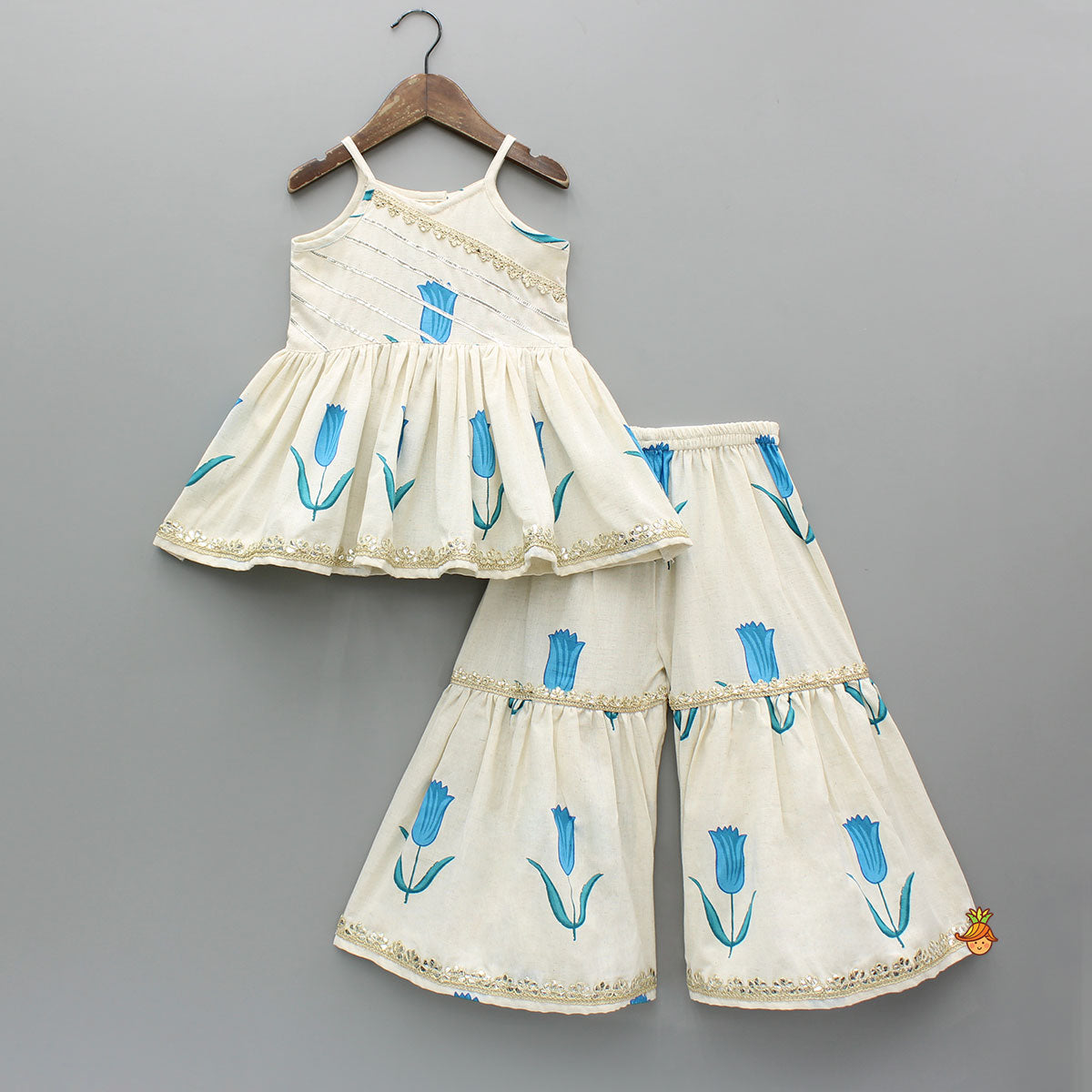 Tulip Printed Strappy Off White Kurti With Printed Sharara And Blue Dupatta