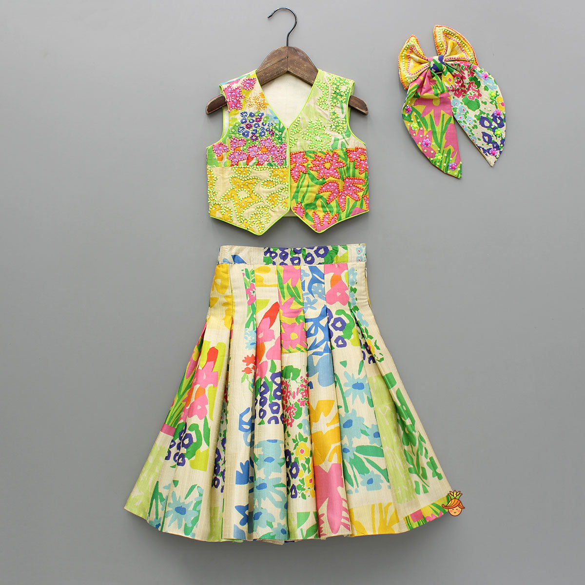 Embroidered Waist Coat Style Top With Skirt Style Lehenga And Bow Hair Clip