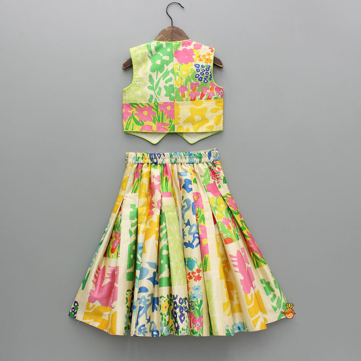 Embroidered Waist Coat Style Top With Skirt Style Lehenga And Bow Hair Clip