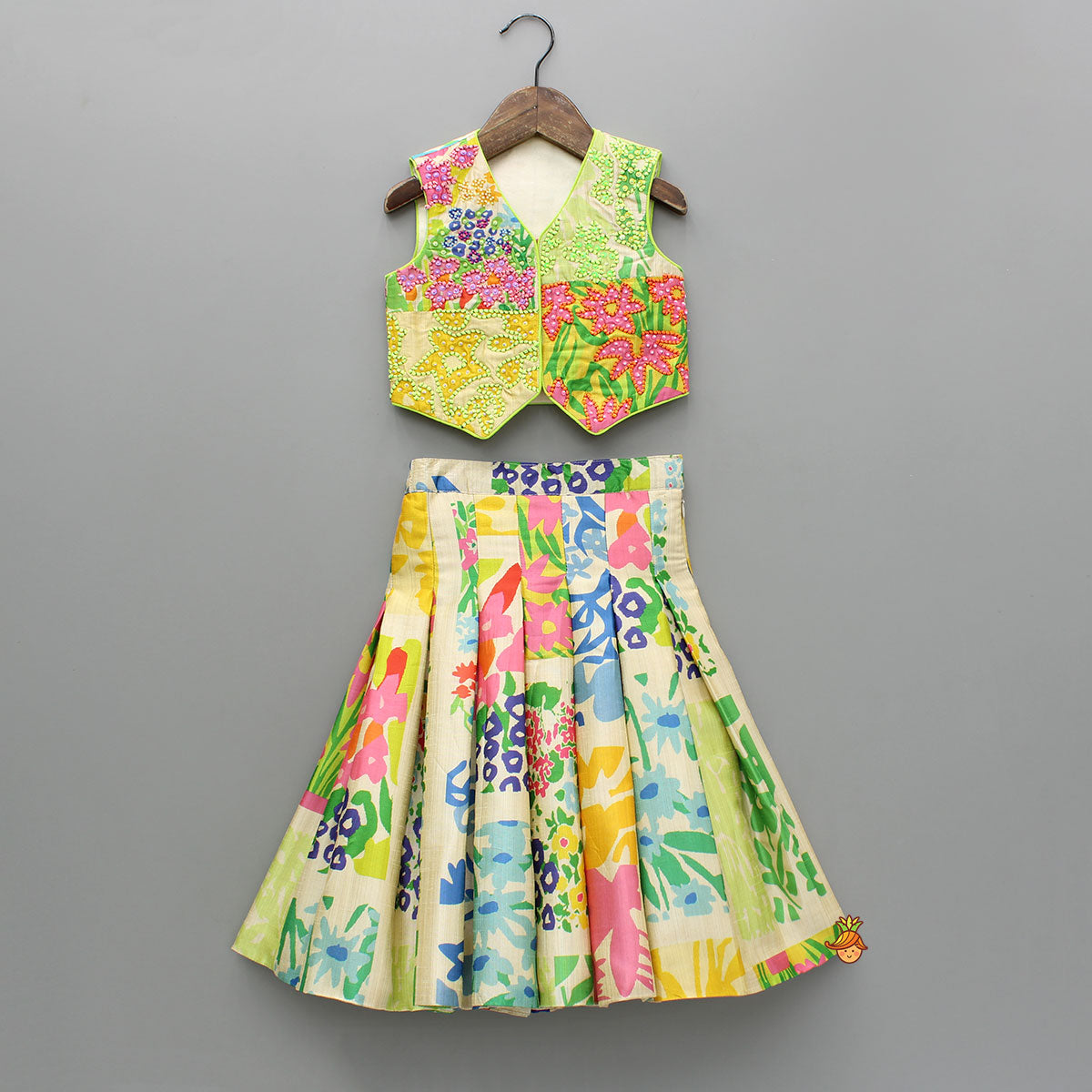 Embroidered Waist Coat Style Top With Skirt Style Lehenga And Bow Hair Clip
