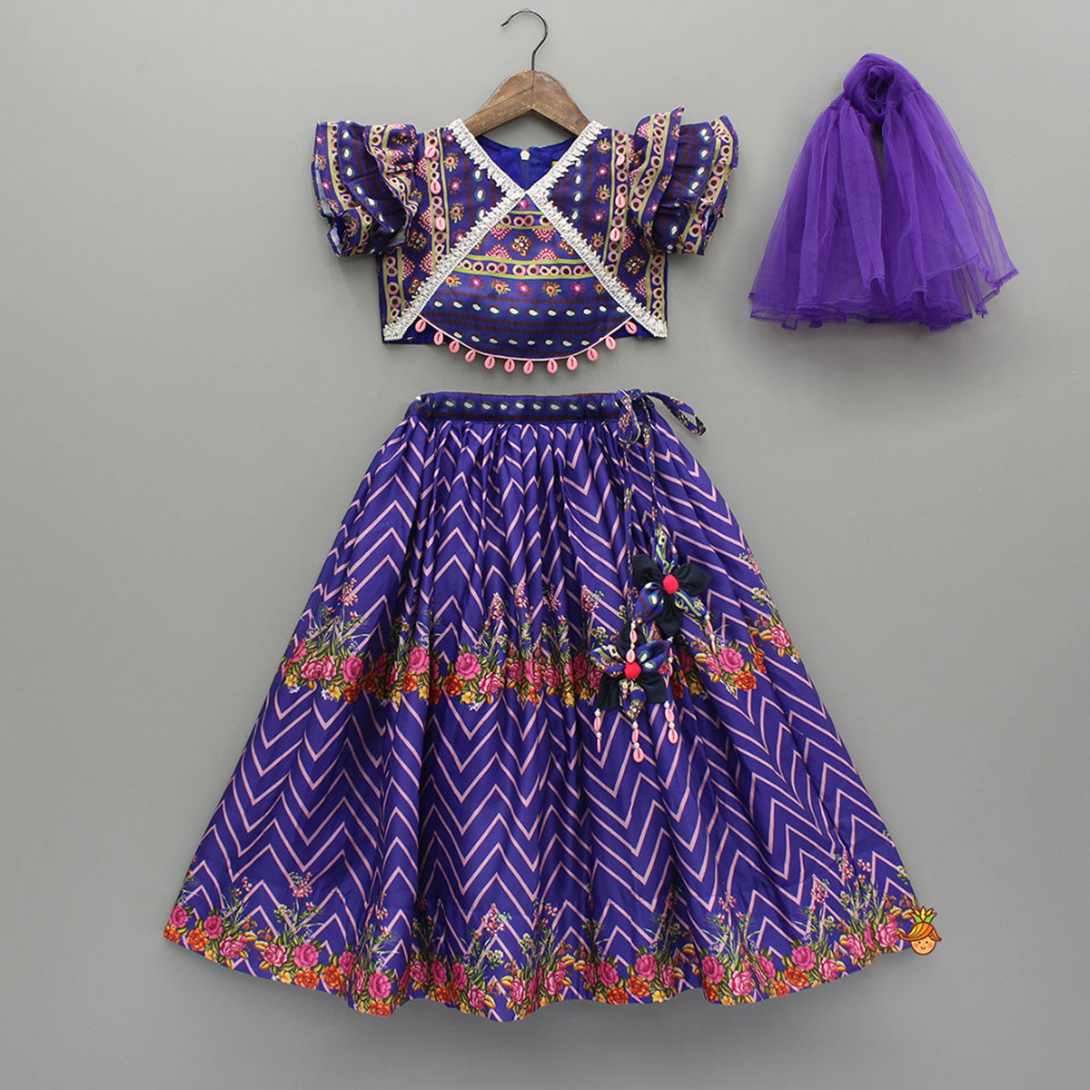 Layered Sleeves Blue Top And Fabric Flower Tassels Enhanced Lehenga With Purple Net Dupatta