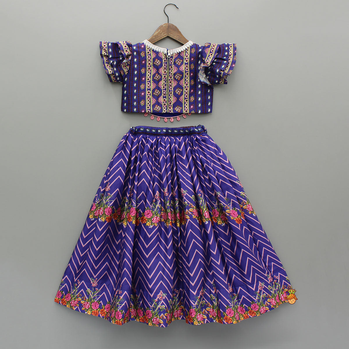 Layered Sleeves Blue Top And Fabric Flower Tassels Enhanced Lehenga With Purple Net Dupatta