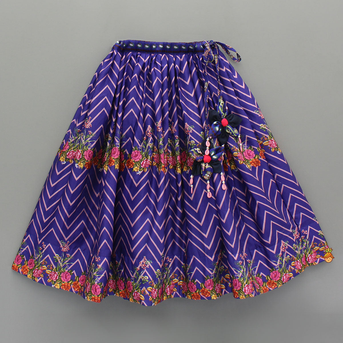 Layered Sleeves Blue Top And Fabric Flower Tassels Enhanced Lehenga With Purple Net Dupatta