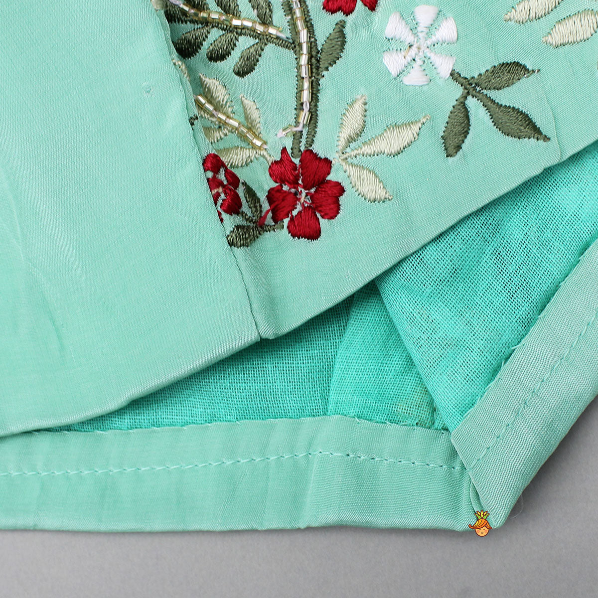 Beautiful Floral Embroidered Green Top With Asymmetrically Layered Lehenga