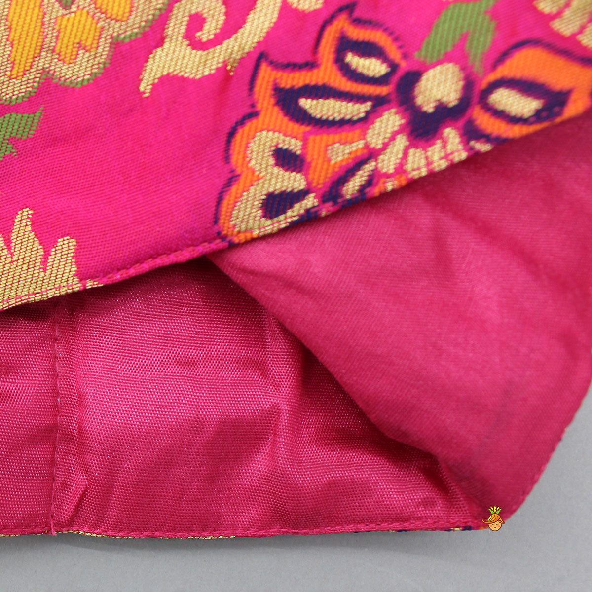 Stunning Bow Embellished Floral Top With Matching Lehenga And Attached Pouch
