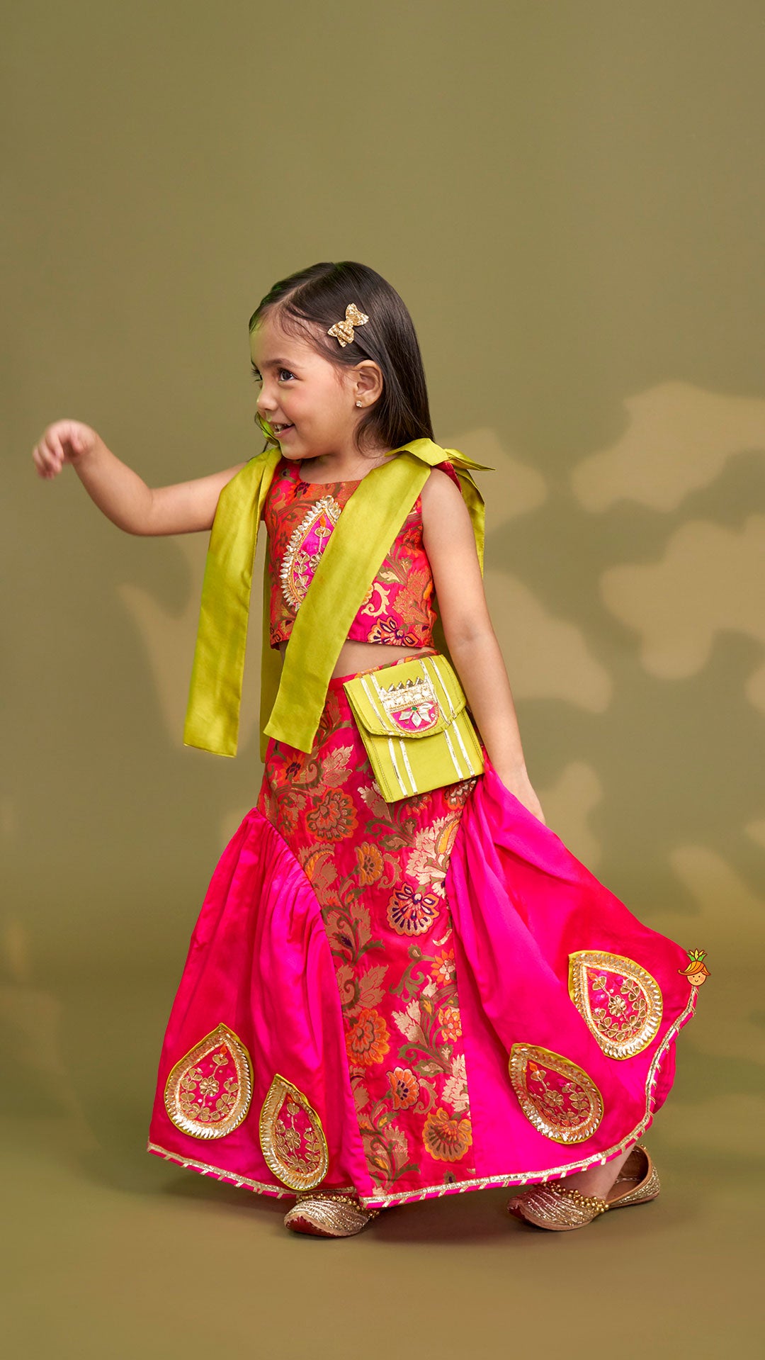 Stunning Bow Embellished Floral Top With Matching Lehenga And Attached Pouch