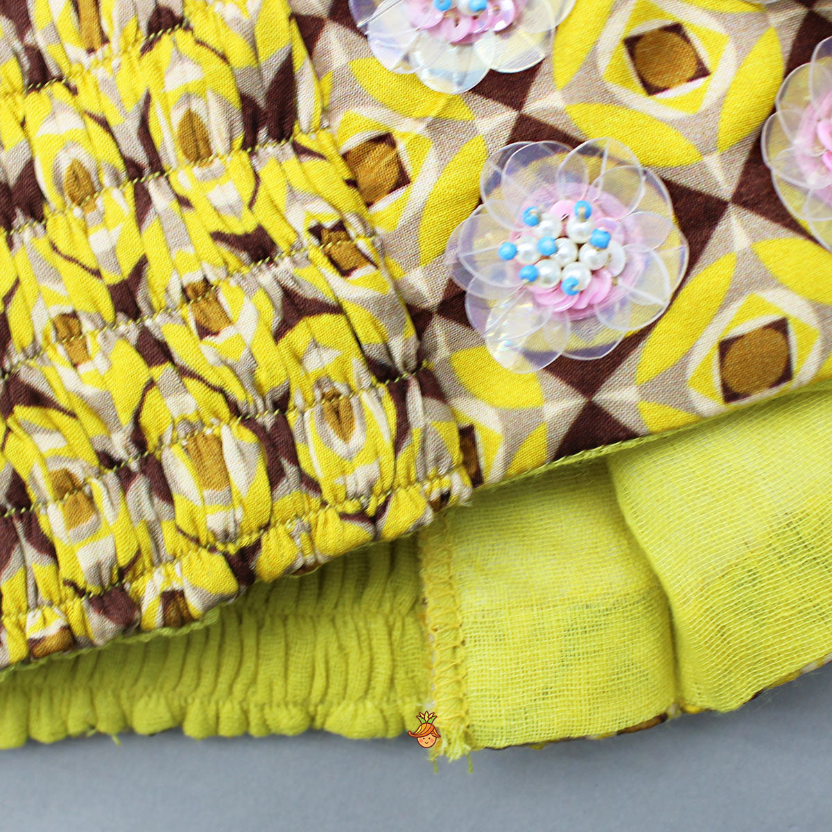 Flowers Adorned Smocked Tie Up Top With Lehenga And Waist Belt