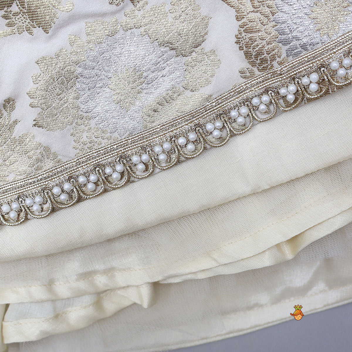 Exquisite Halter Neck Brocade Top With Embellished Jacket And Brocade Lehenga With Matching Hair Band