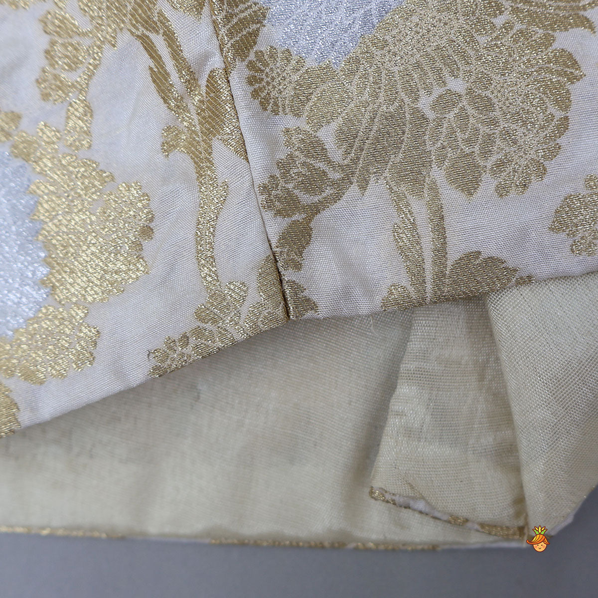 Exquisite Halter Neck Brocade Top With Embellished Jacket And Brocade Lehenga With Matching Hair Band