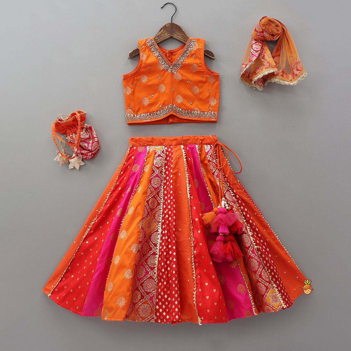 Embroidered Elegant Top And Brocade Lehenga With Matching Net Dupatta And Brocade Potli Bag