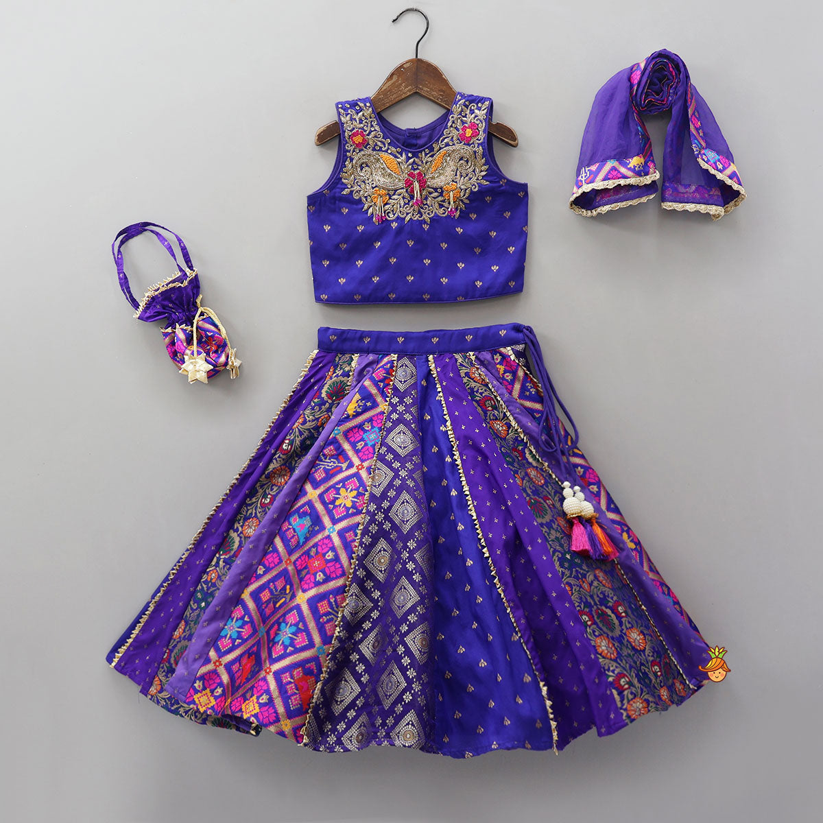 Gorgeous Embroidered Top And Brocade Lehenga With Matching Net Dupatta And Brocade Potli Bag