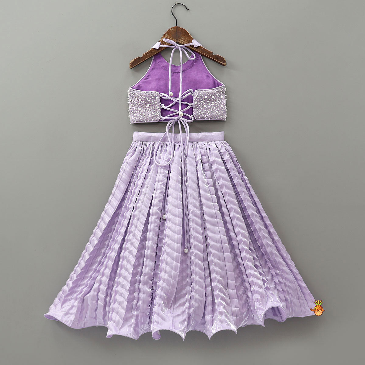 Stunning Criss-Cross Back Knot Top And Crushed Sheen Lehenga With Matching Hair Tie