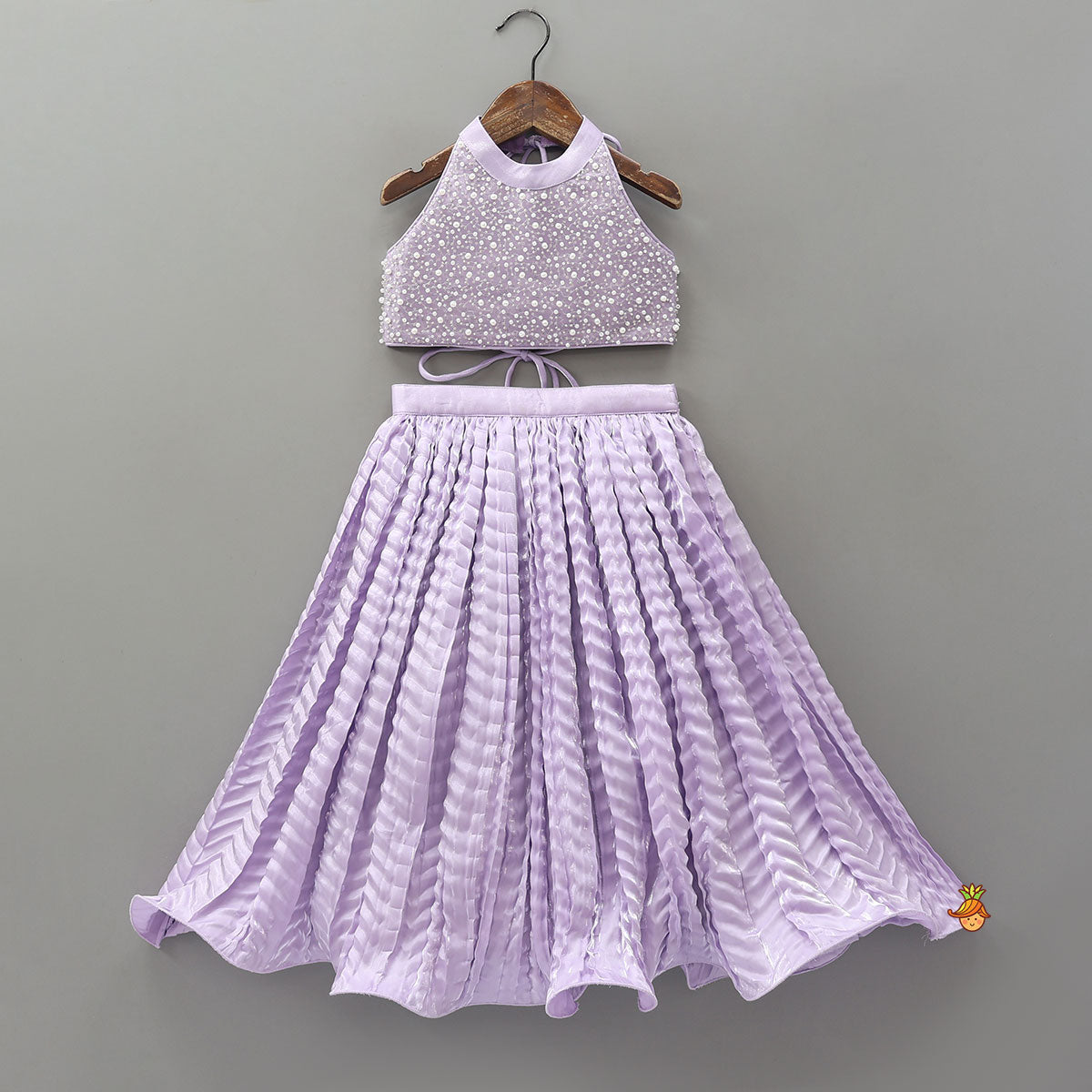 Stunning Criss-Cross Back Knot Top And Crushed Sheen Lehenga With Matching Hair Tie