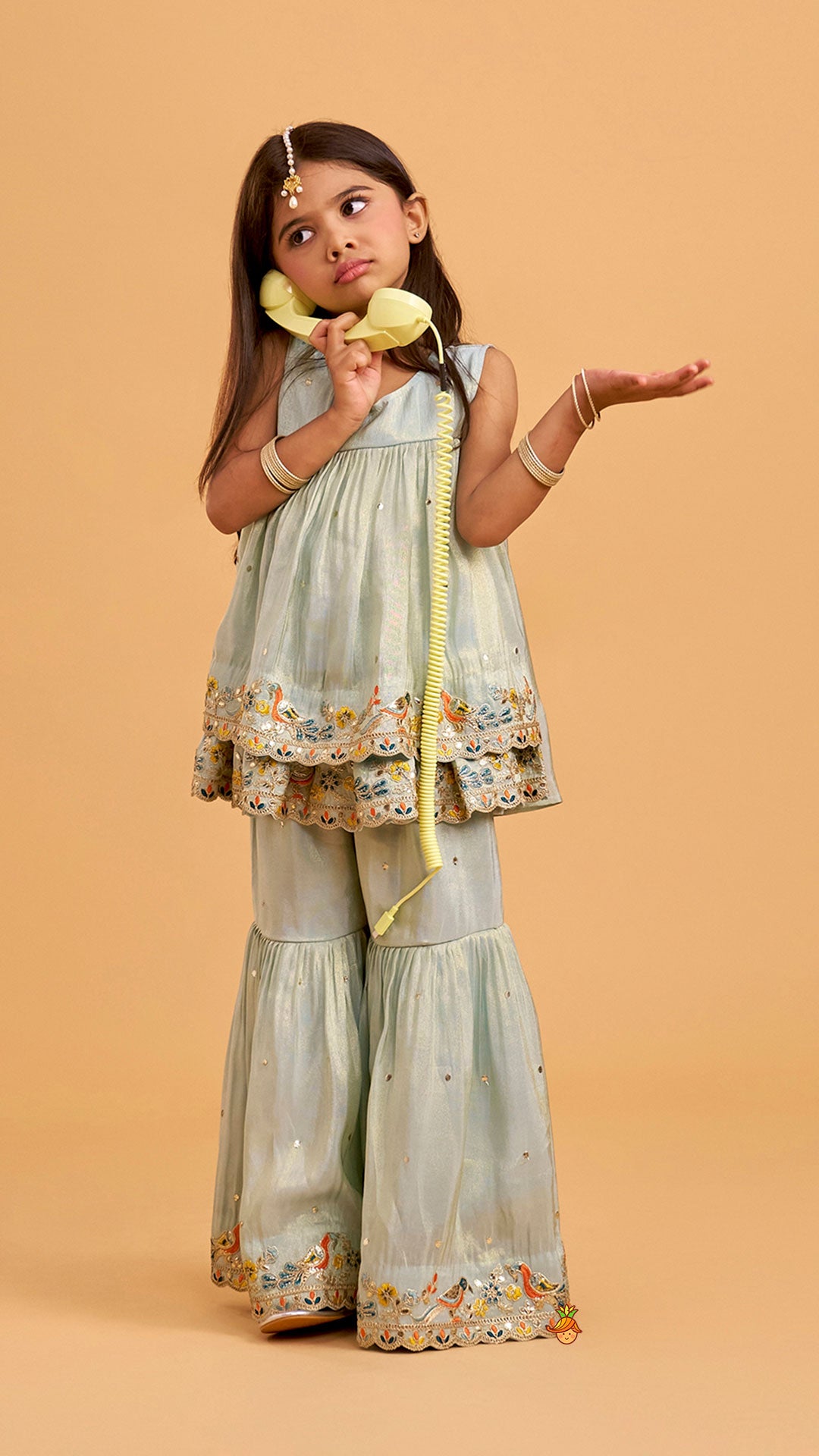 Layered Shimmery Kurti And Sharara With Contrasting Dupatta