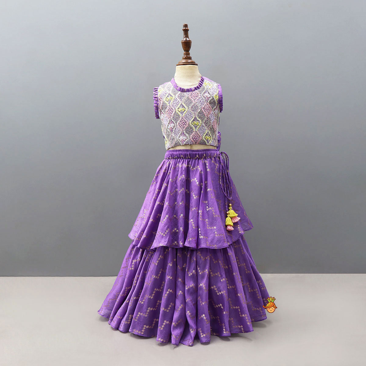 Trendy Open-Back Crop Top And Layered Lehenga